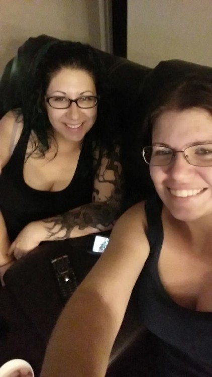 two women wearing black tank tops selfie