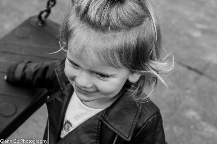 A young girl smiling. 