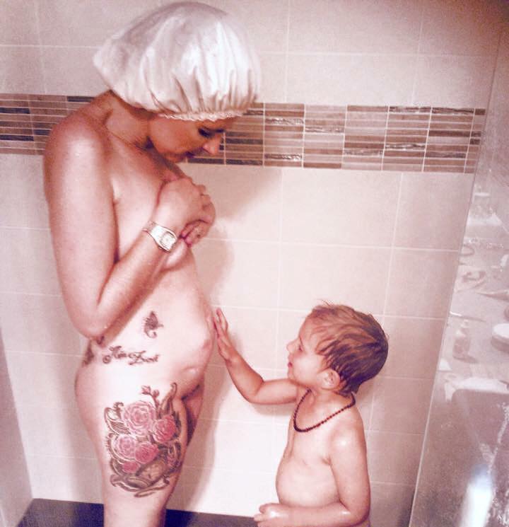 Miller in the shower with her son, he's touching her stoma. 