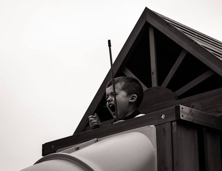 A young boy on a playground. 