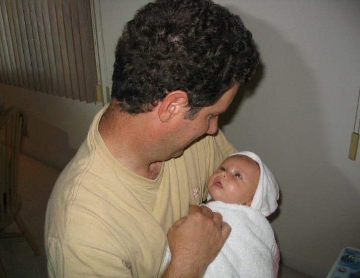 father holding baby