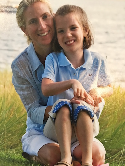 daughter sitting in mother's lap