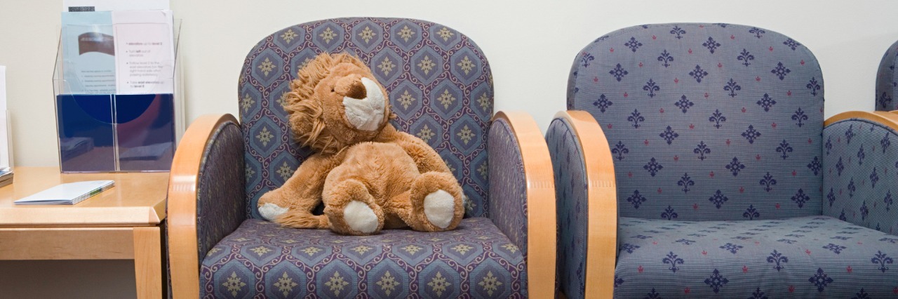 Why Medically Complex Families Sometimes Want to Avoid the Hospital Lion stuffed animal on chair in hospital waiting room