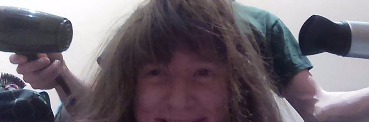 How My Loved Ones Help Me as a Woman With Disabilities man blow-drying woman's hair