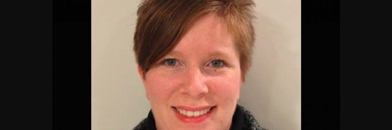 When You Feel Pressure to Be 'Well' Contributor, a white woman with short brown hair, smiling and looking straight ahead