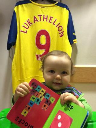 Luka sitting in front of a LukaTheLion Jersey