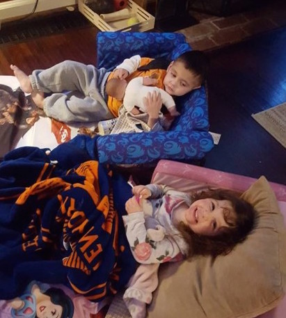 boy and girl lying on couches