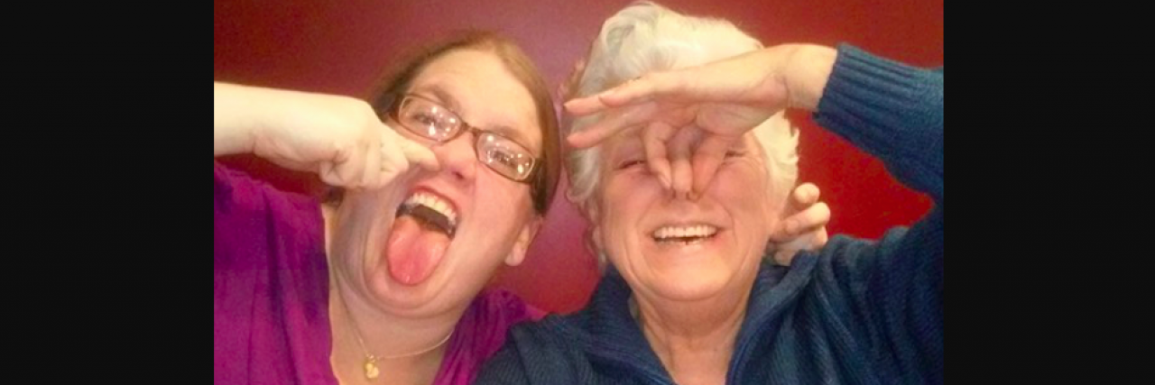 Two white women making silly faces