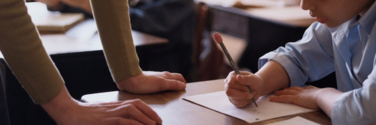 Thoughts on Education From a Special Needs Mom and Educator teacher helping a student