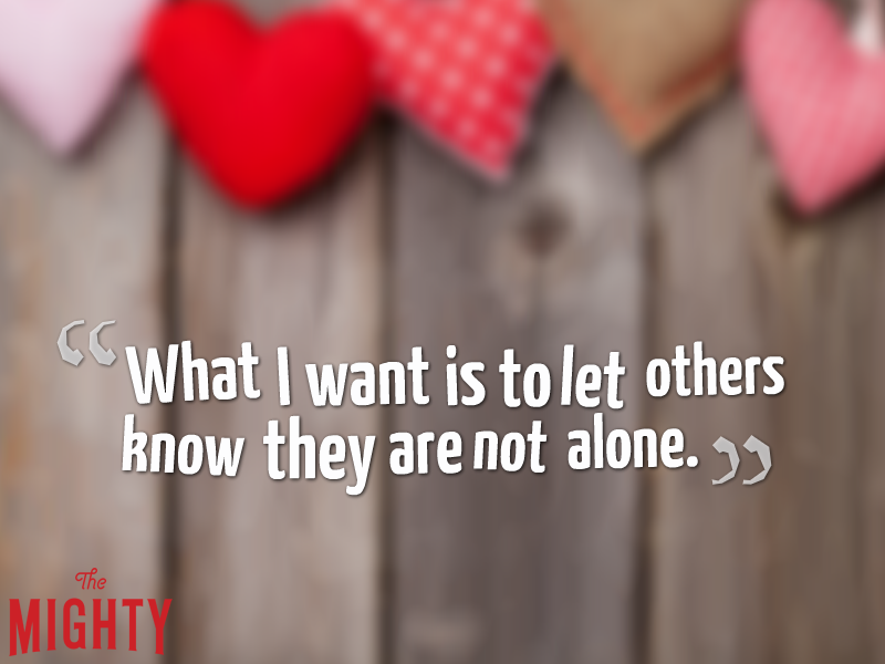 The text "What I want is to let others know they are not alone" on a background featuring wooden planks and a series of hearts