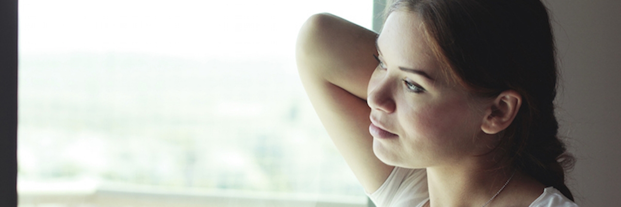 Feeling Guilty About Health Choices When You Have an Illness Woman looking out the window