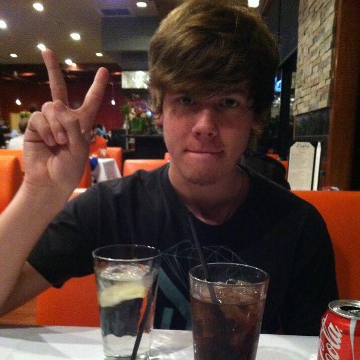 Jennifer's son, making a peace sign.