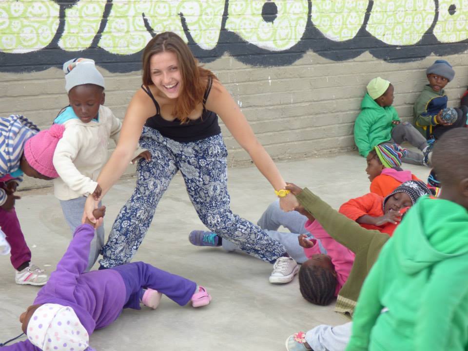 author playing with children in park