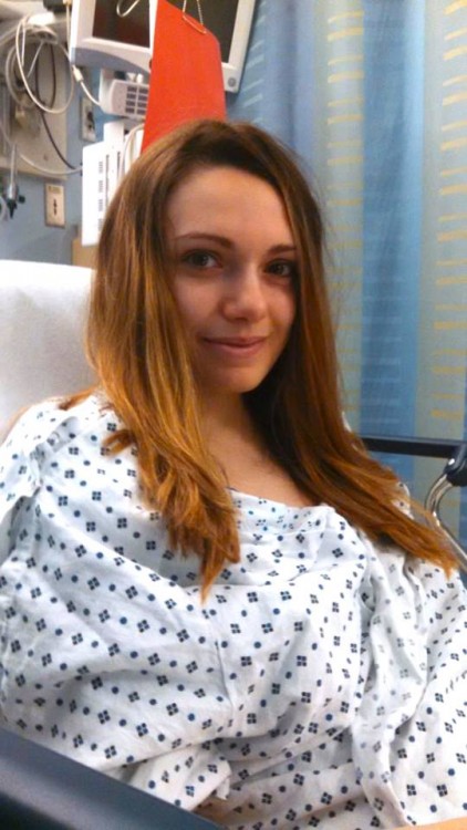 Sarah in a hospital gown.