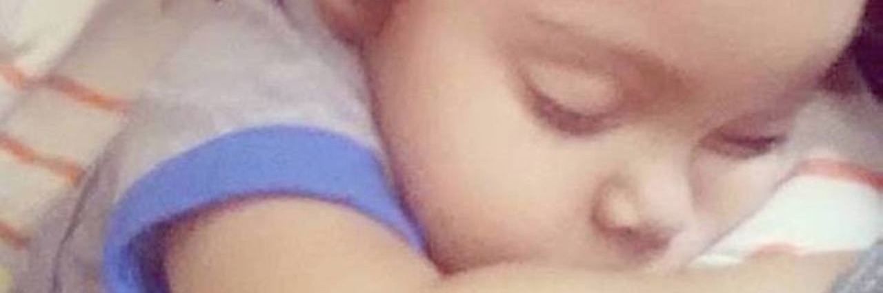 Life Lessons Learned From Parenting Toddler With Short Bowel Syndrome baby sleeping on moms shoulder