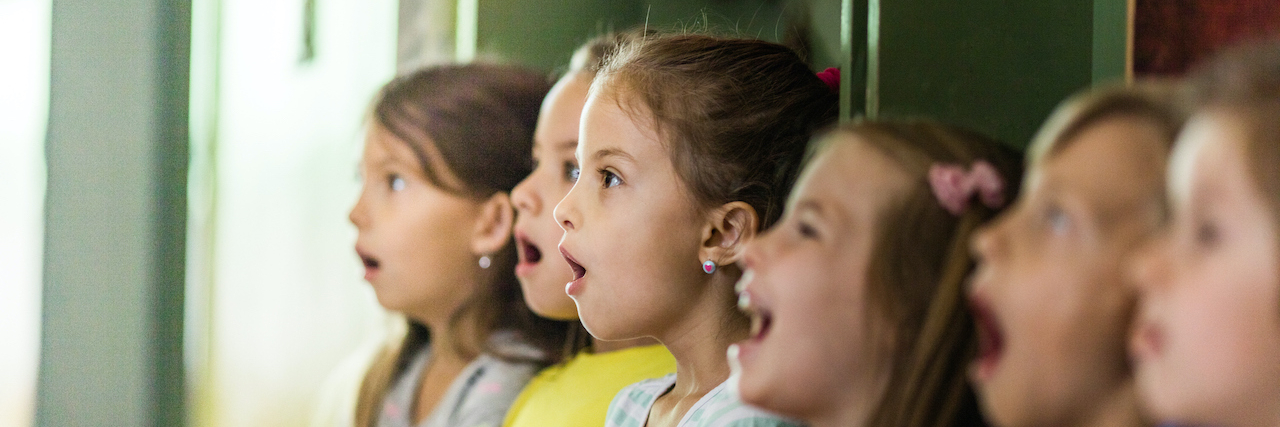 Group of elementary students singing in choir