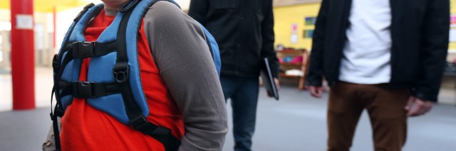 little boy wearing nesel backpack