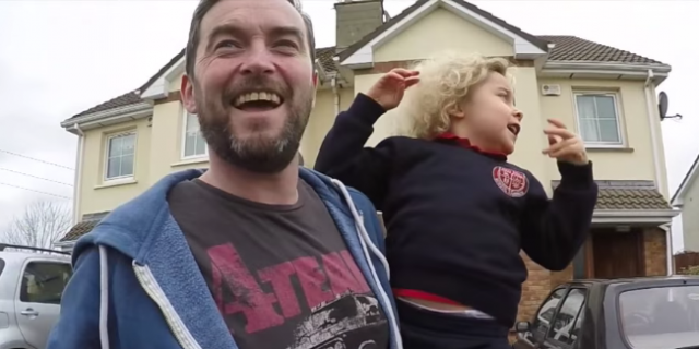 dad holding daughter