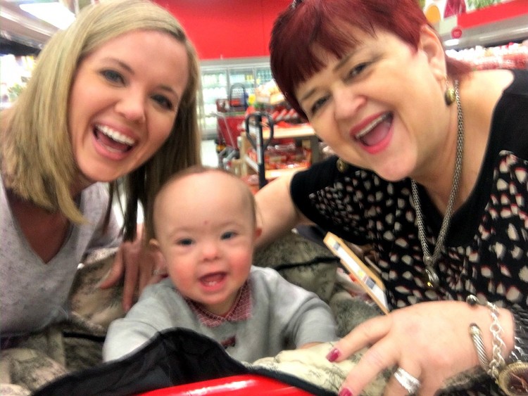 two women and young baby smiling