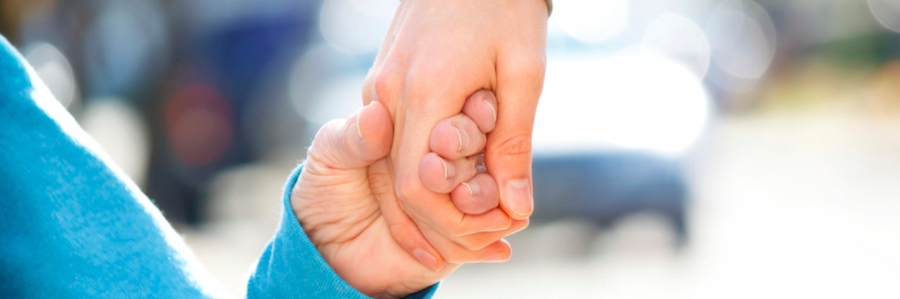 Credit for Caring Bill Would Give Caregivers Tax Credit Caregiver Holding Senior's Hand