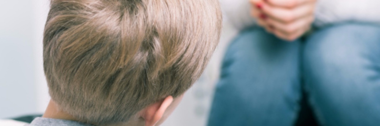 Telling Your Child They Have Autism parent talking to little boy