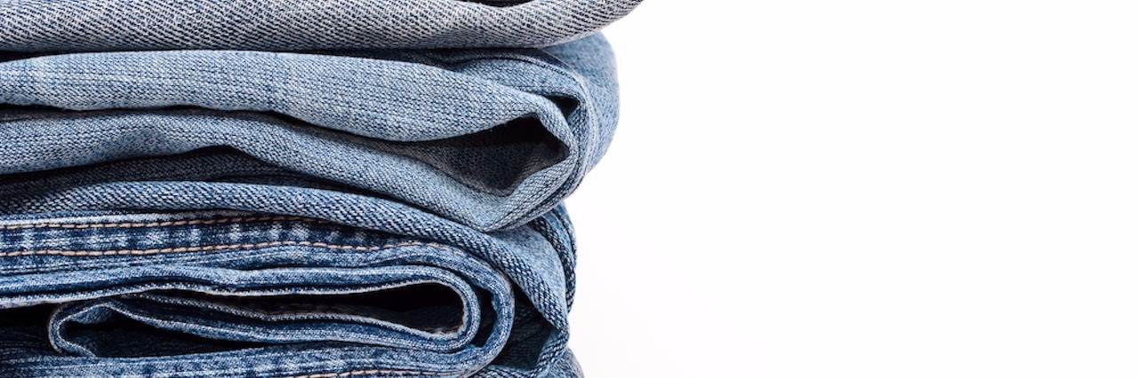 stack of blue jeans