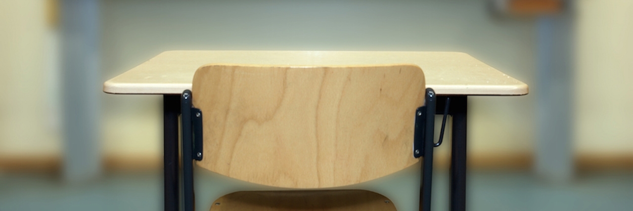 Advice for Children Who Have Lost Parents to Suicide empty desk in classroom