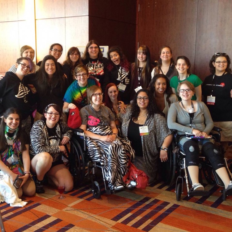 large group of women posing for photo at conference