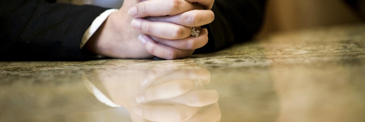 What I Wish People in My Daughter's IEP Meetings Knew A pai of hands crossed and resting on a table
