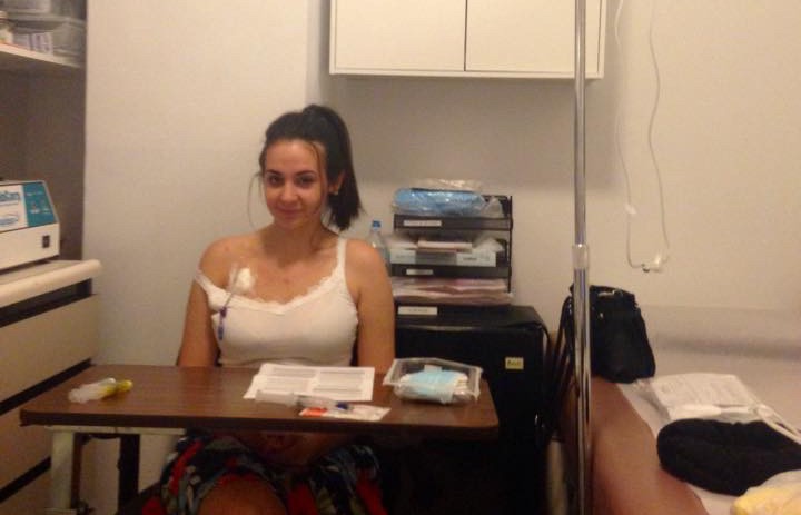 What I Wish I Knew During the Struggle to Get My Lyme Disease Diagnosis young woman sitting in doctor's office with IV