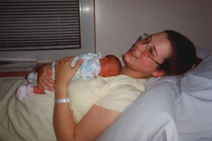 mother holding newborn baby