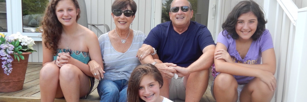 How We Told Our Children Their Grandfather Had Taken His Life grandparents sitting on porch with three grandchildren