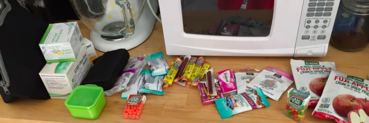 A bunch of diabetes supplies and medication on counter