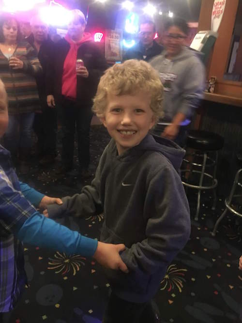 Brock, Lindsay's son playing with a friend and smiling