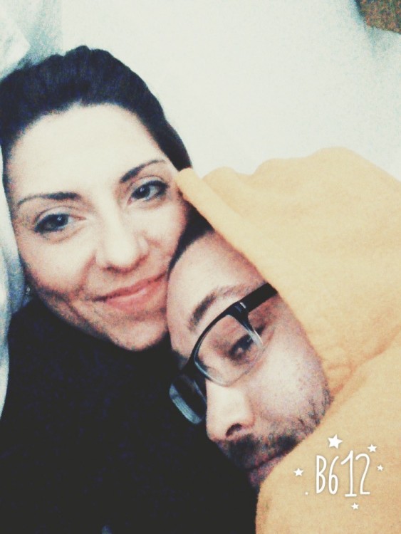 woman and man wearing glasses and a hooded sweatshirt