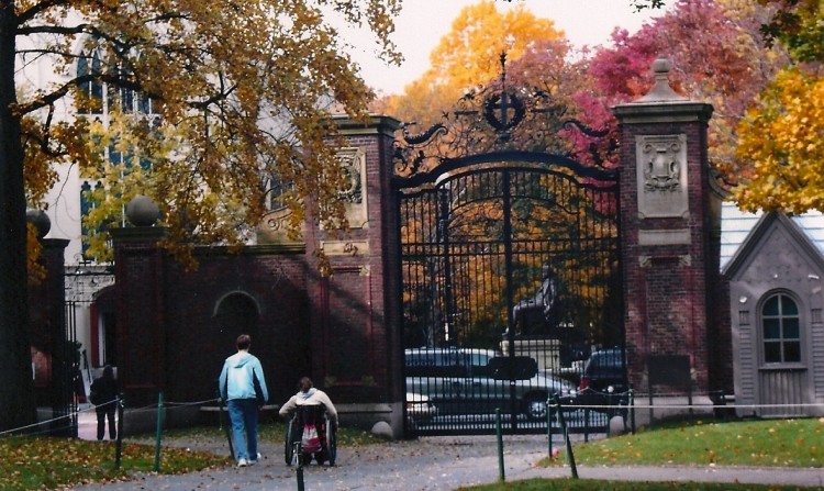 Beth with her mom Cindy at Harvard near brick and iron gates