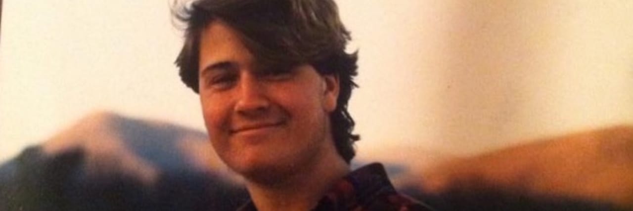 When You Still Feel Grief From Your Sibling's Death 25 Years Later man in plaid shirt smiling