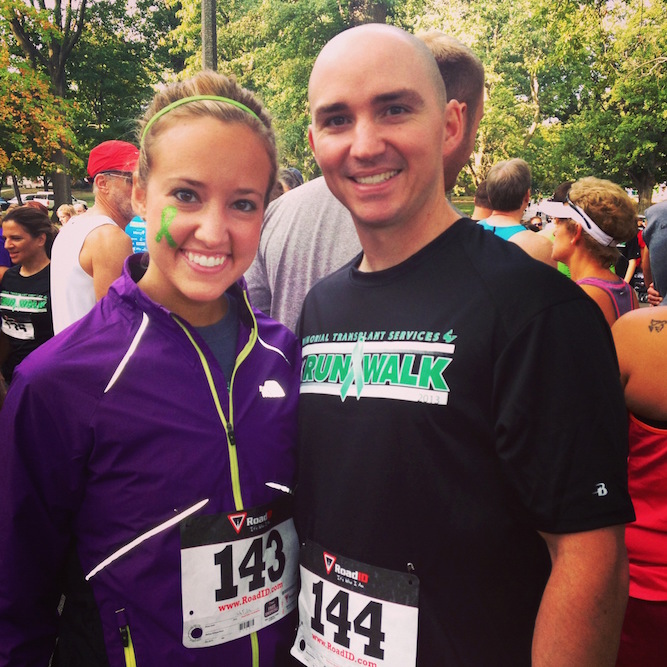 a woman and man in running gear