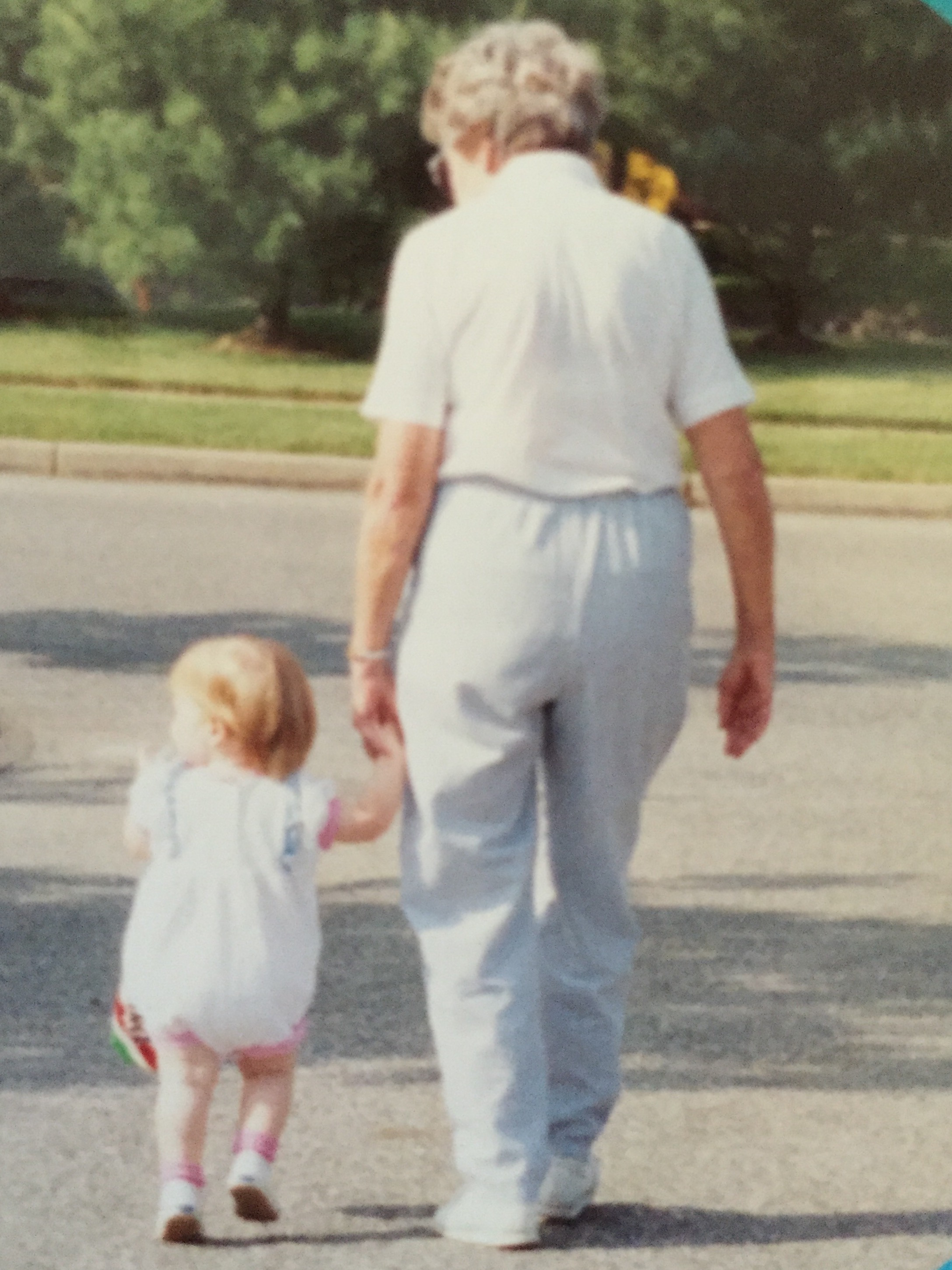 megan as a baby, walking with her nana