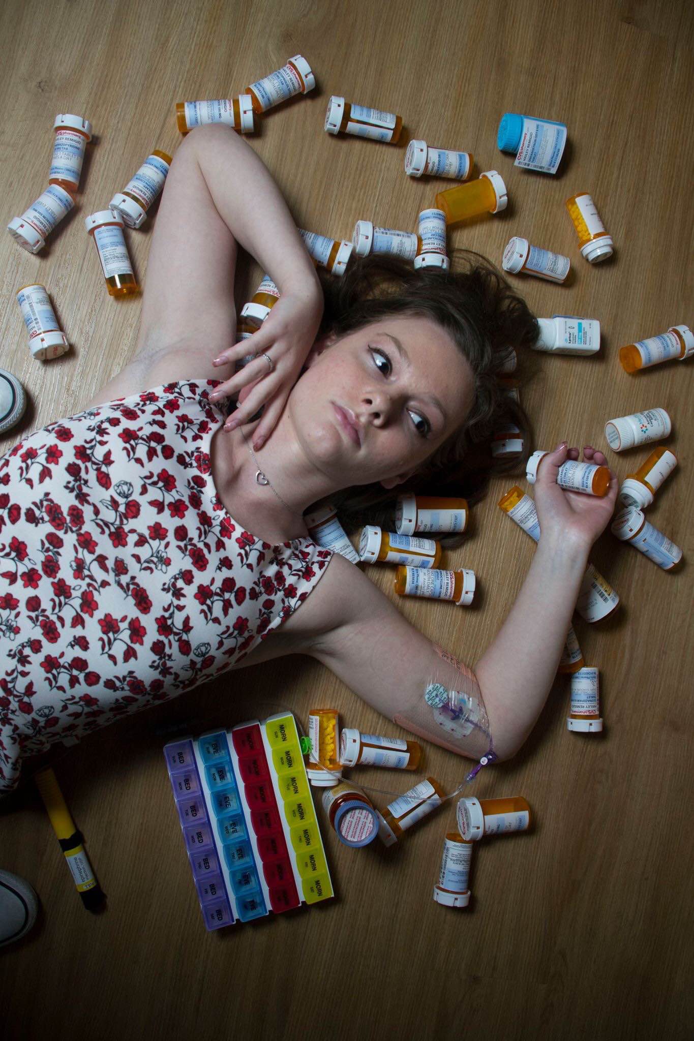 hailey laying on top of pill bottles