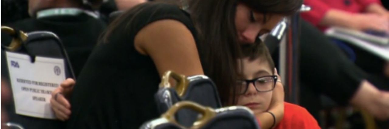 FDA Panel Approves on Two Duchenne Muscular Dystrophy Drugs Mother hugging son
