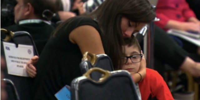 FDA Approves New Duchenne Muscular Dystrophy Drug After Earlier Controversy Mother hugging son