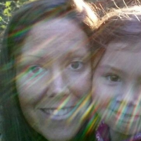 mom and daughter smiling