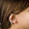 Little girl wearing a hearing aid