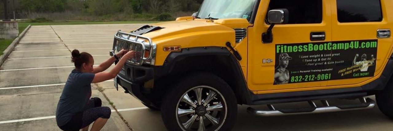 Psoriatic Arthritis: Living an Active Lifestyle With Symptoms Woman pushing yellow Hummer in parking lot