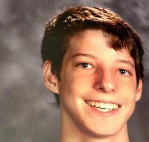 Brooks in high school. A teen boy with short brown hair, smiling.