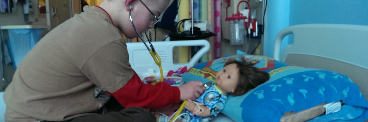 The Week Before My Child's Surgery boy playing doctor with doll