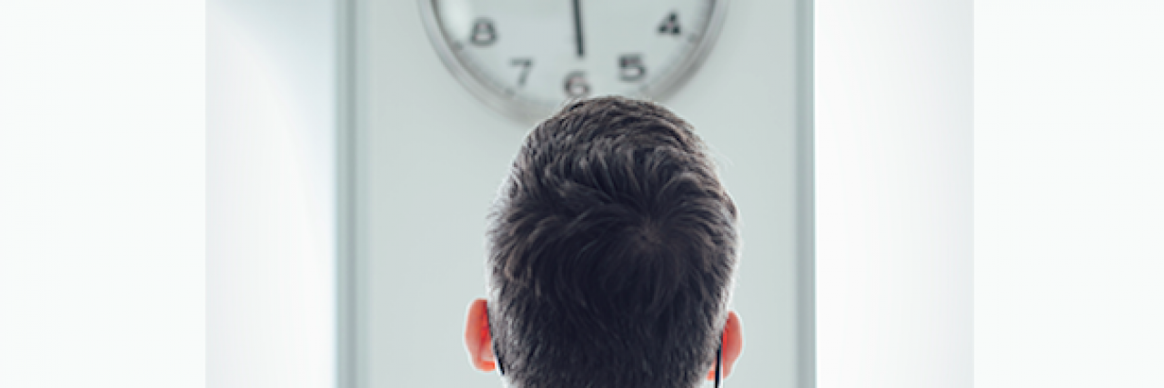 When You Can't Work Full-Time Because of Your Mental Illness Man looking at a clock