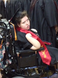 girl in wheelchair attending graduation ceremony