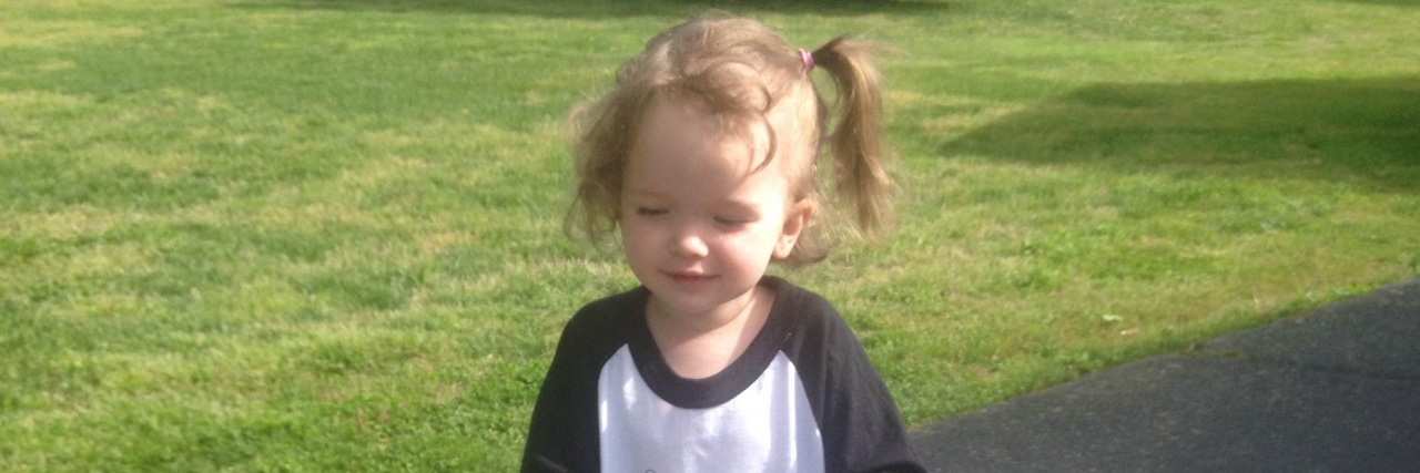 Taking My Daughter With Hydrocephalus Out With Her Gait Trainer Tillery with her gait trainer.